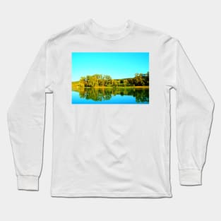 Scene from Lago Cedri in Lapedona with trees bathed in sunlight and the calm waters of the lake reflecting that lushness Long Sleeve T-Shirt